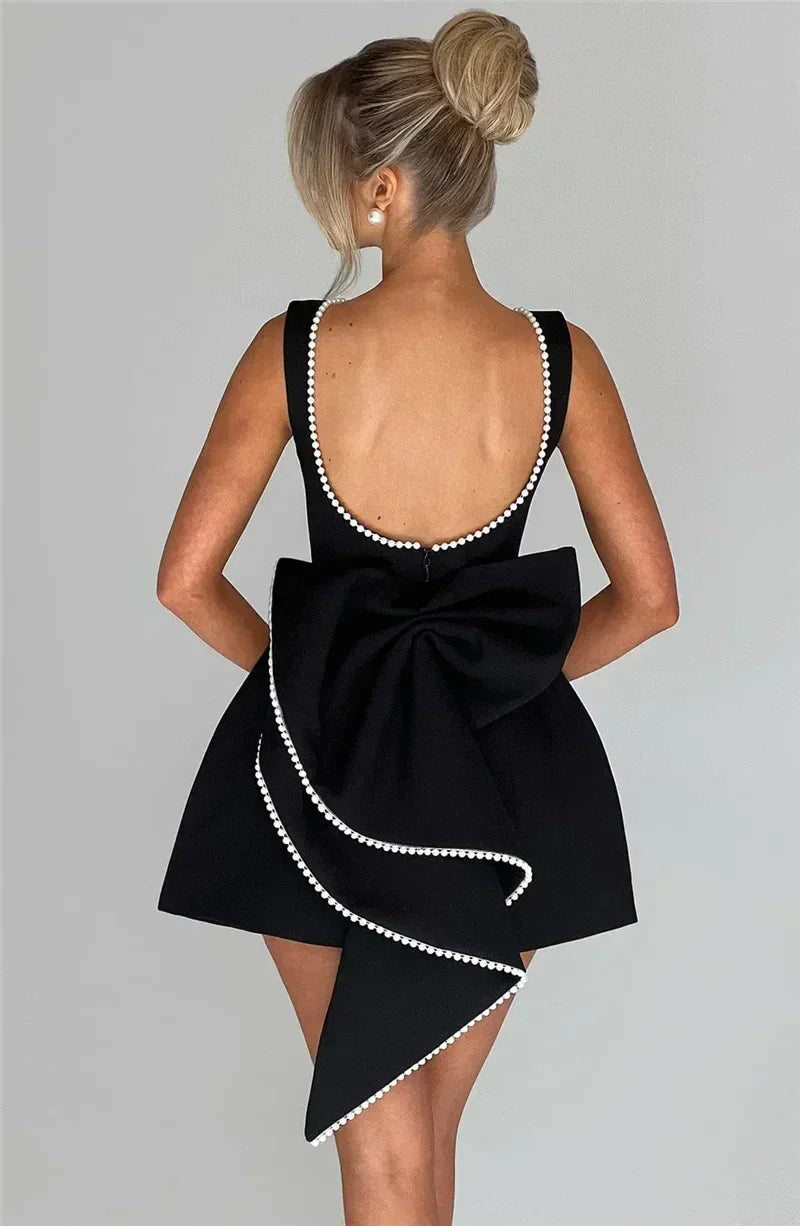 Mozision Pearl Bow Backless Sexy Mini Dress For Women Robe Fashion Zipper Sleeveless High Waist A-line Club Party Dress Elegant